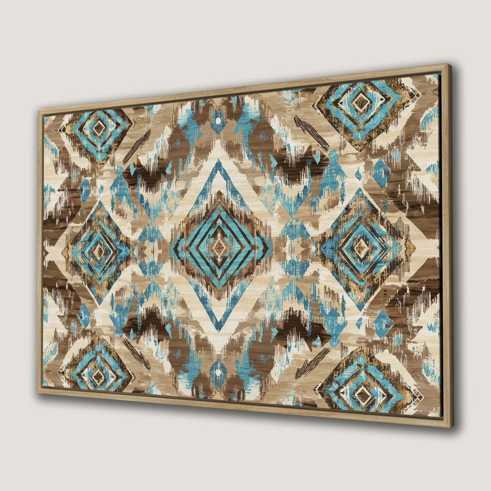 Framed Wall Art featuring a geometric ikat design in turquoise, brown, and beige. Perfect for adding a touch of boho style to your home.