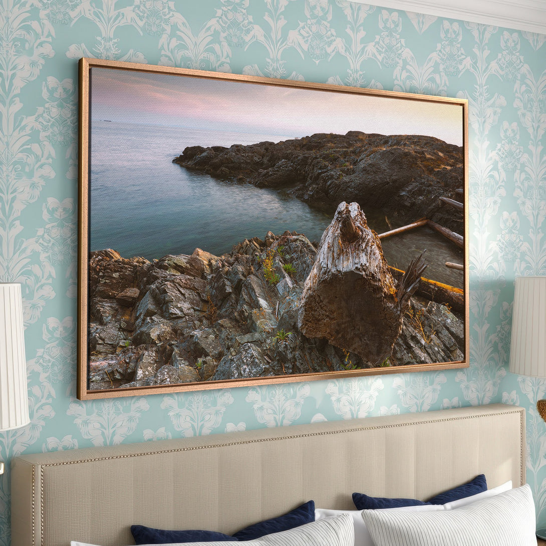 Framed Wall Art: Coastal landscape Canvas Print with rocky shoreline in muted blues and browns. Perfect for adding a touch of nature to your home decor.
