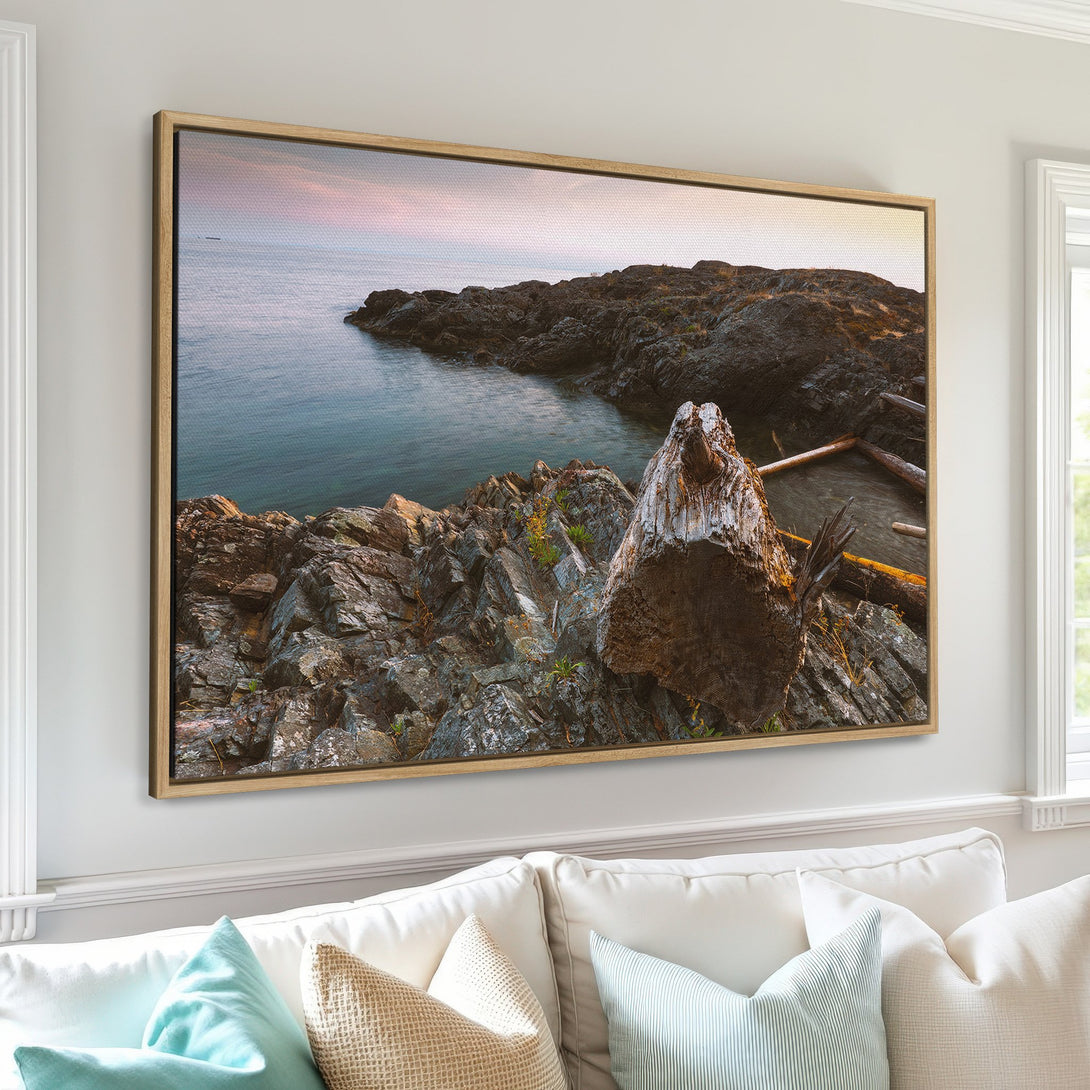 Framed Wall Art of a coastal landscape with rocks and water. Earthy tones of brown, gray, and blue create a calming, natural aesthetic. Perfect for any home!