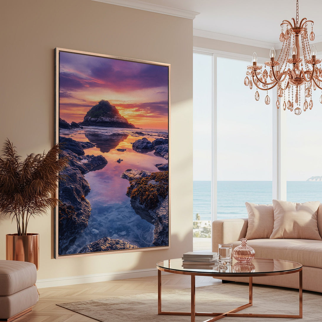 Framed Wall Art: Coastal sunset canvas print in a modern living room. Features a vibrant color palette of blues, oranges, and purples. Elevate your space!