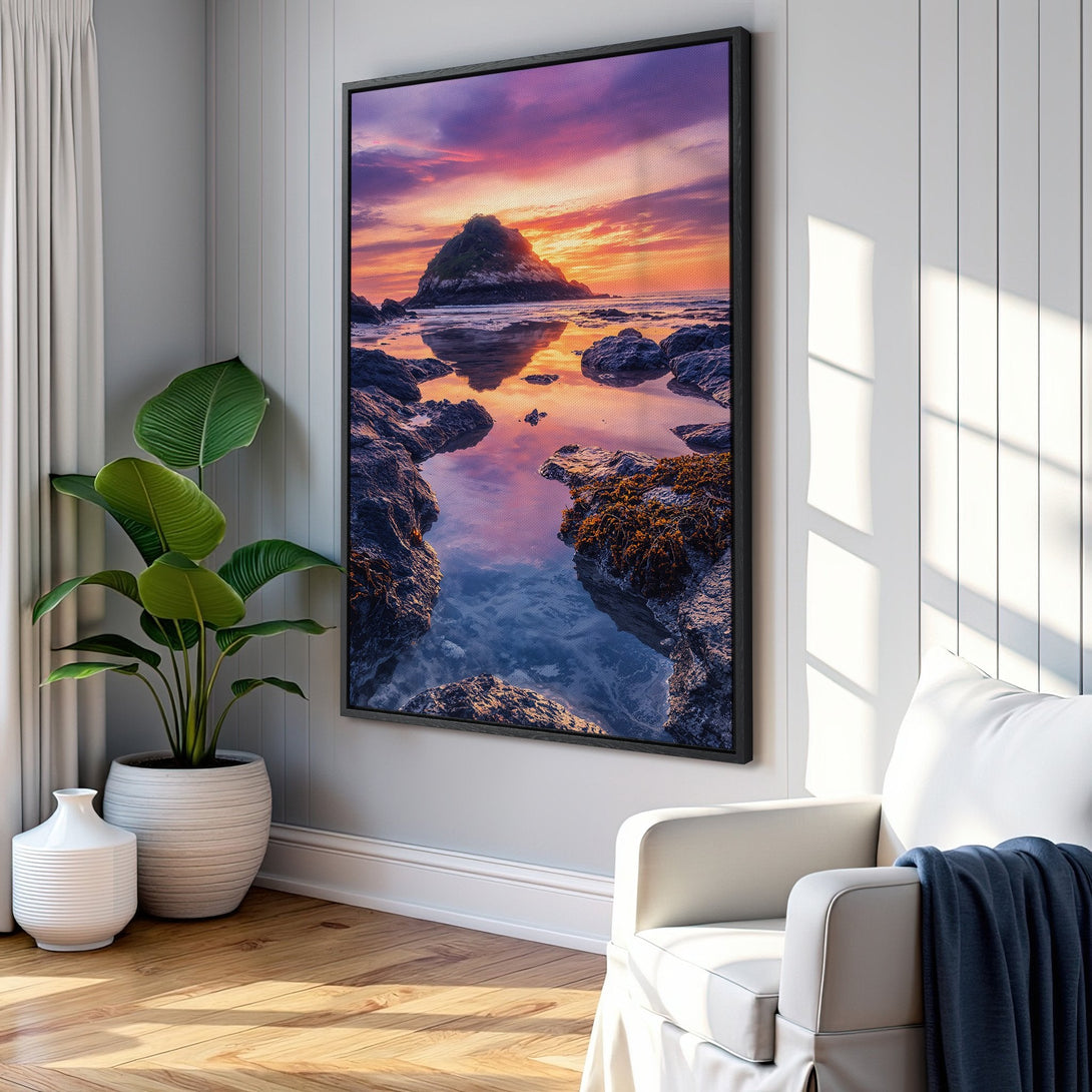 Framed Wall Art: Coastal sunset Canvas Print in a modern interior. Features vibrant orange, purple, and blue hues. Perfect for adding a touch of nature to your home decor.