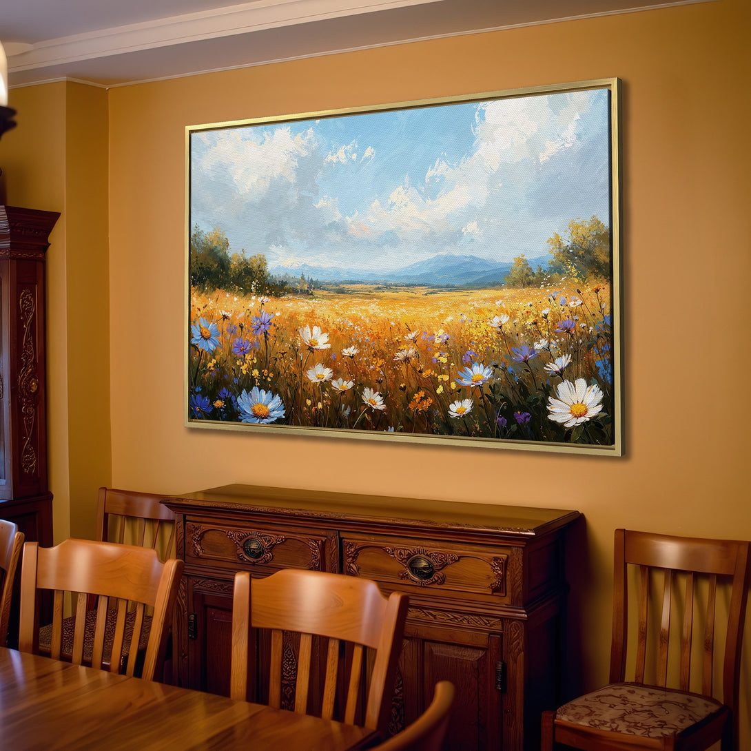 Canvas Print of a vibrant wildflower field painting in a warm, inviting interior. Features blue, yellow, and white blooms under a blue sky.
