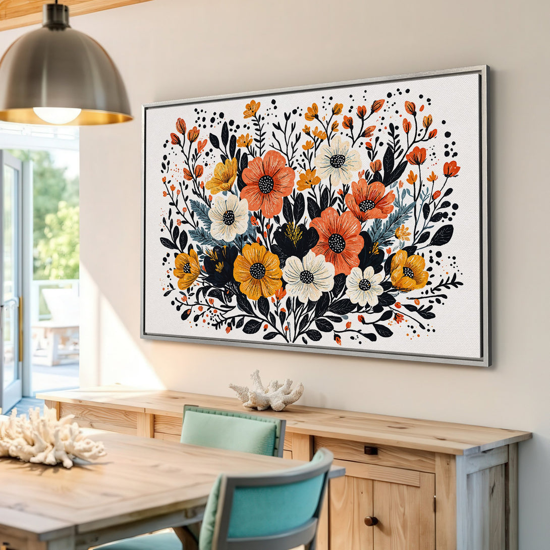 Framed Wall Art featuring a vibrant floral design in warm orange, yellow, and black hues. Perfect for adding a pop of color to any room.