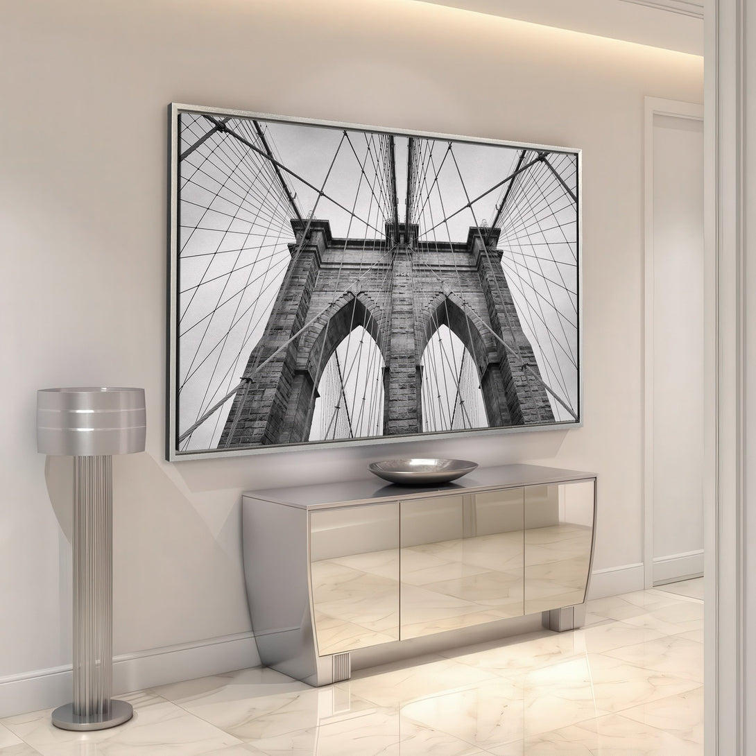 Framed Wall Art: Brooklyn Bridge in black and white. Modern canvas print adds a sophisticated touch to any interior. Elevate your space with this iconic image.