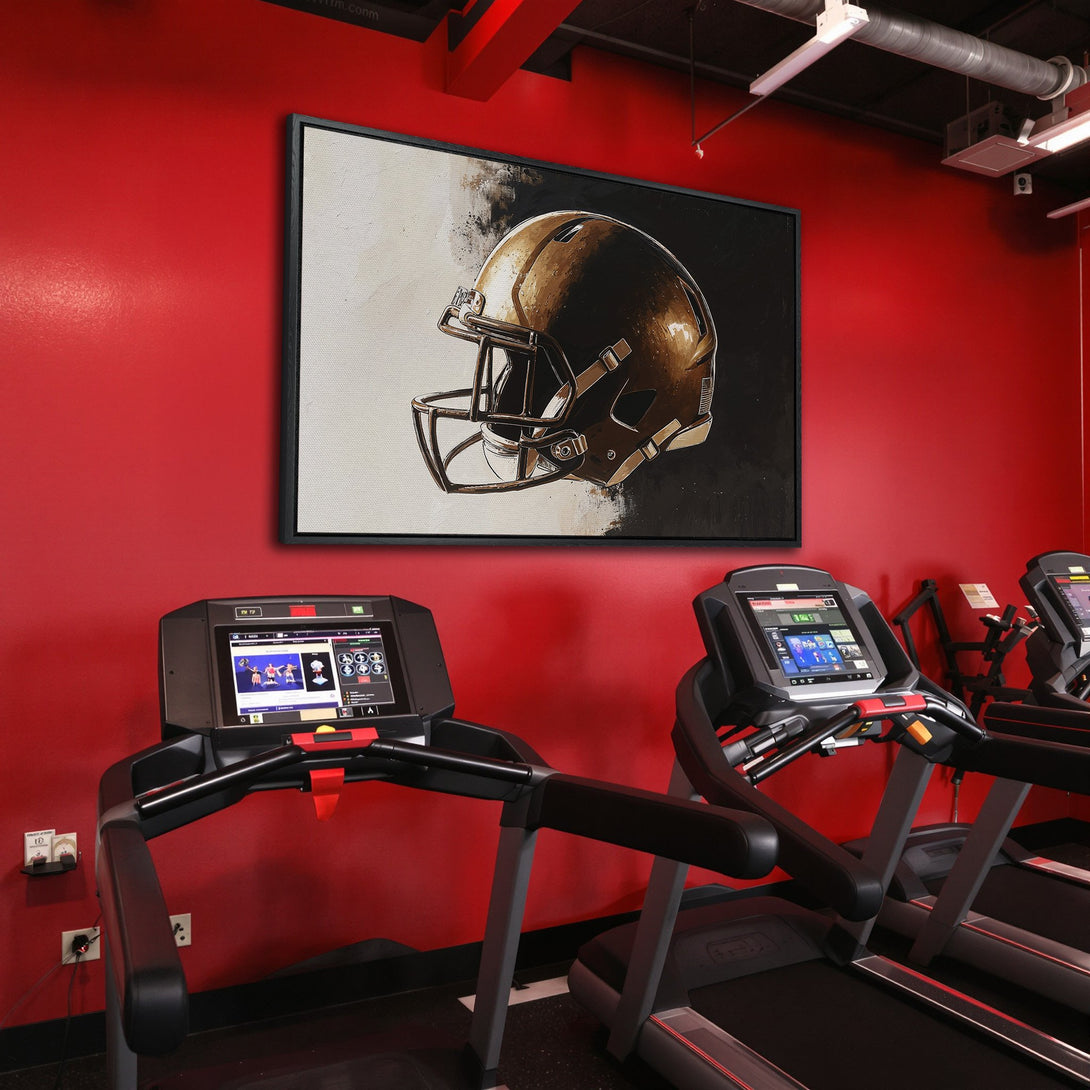 Framed Wall Art: Football helmet artwork in a gym setting. Abstract style with gold and black tones against a red wall. Perfect for sports fans!