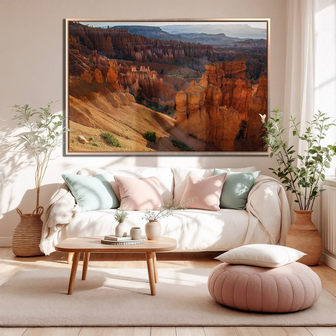Framed Wall Art of Bryce Canyon landscape in warm orange tones, perfect for adding a touch of nature to your living room decor.