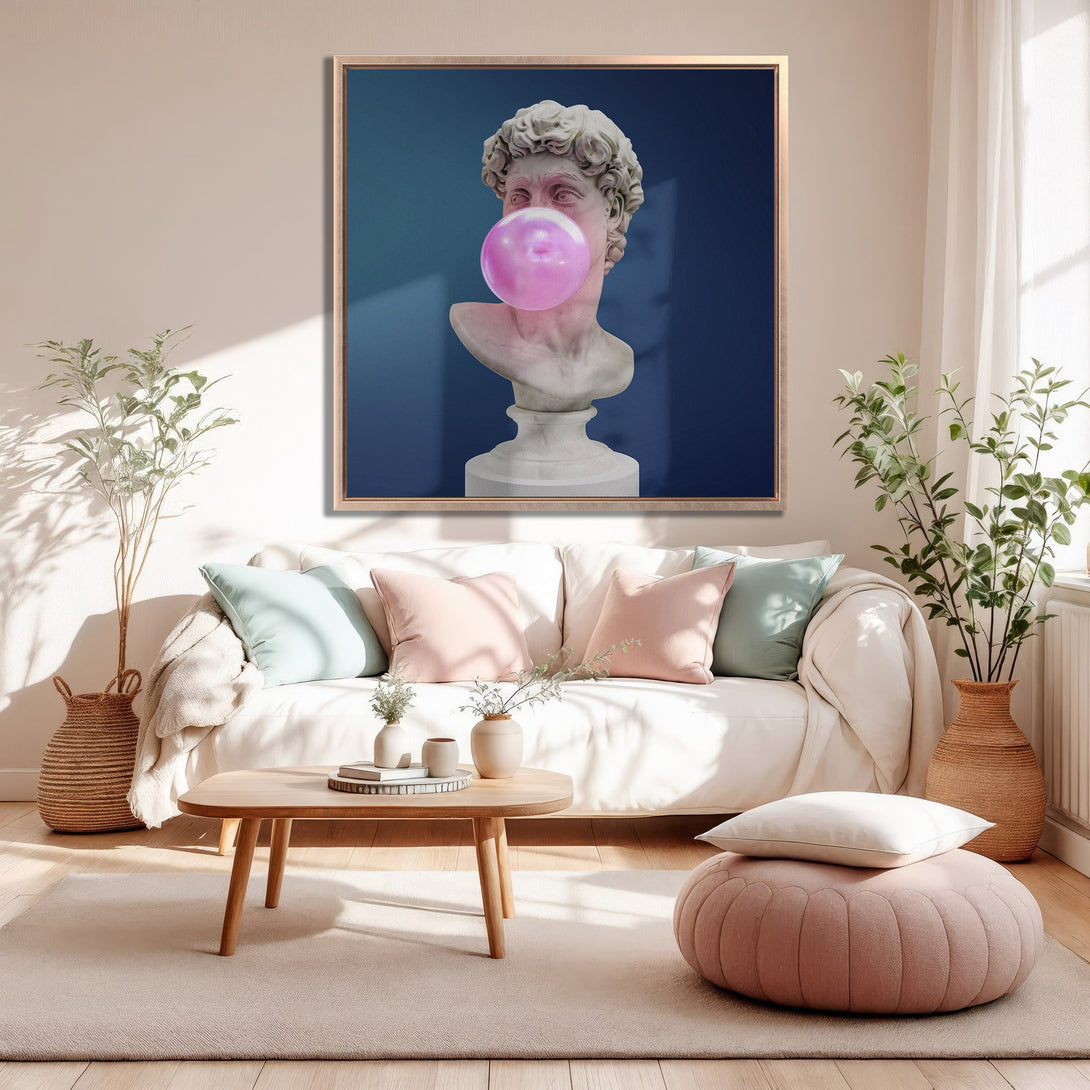 Framed Wall Art: David bust with bubblegum, modern art in a living room. Features a blue, pink, and neutral color palette for stylish home decor.