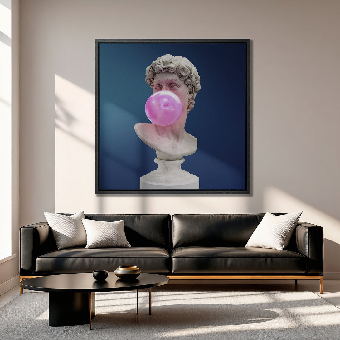 Framed Wall Art featuring a classical bust with bubblegum, modern pop art style. Blue, pink, and neutral color palette, perfect for adding a unique touch.