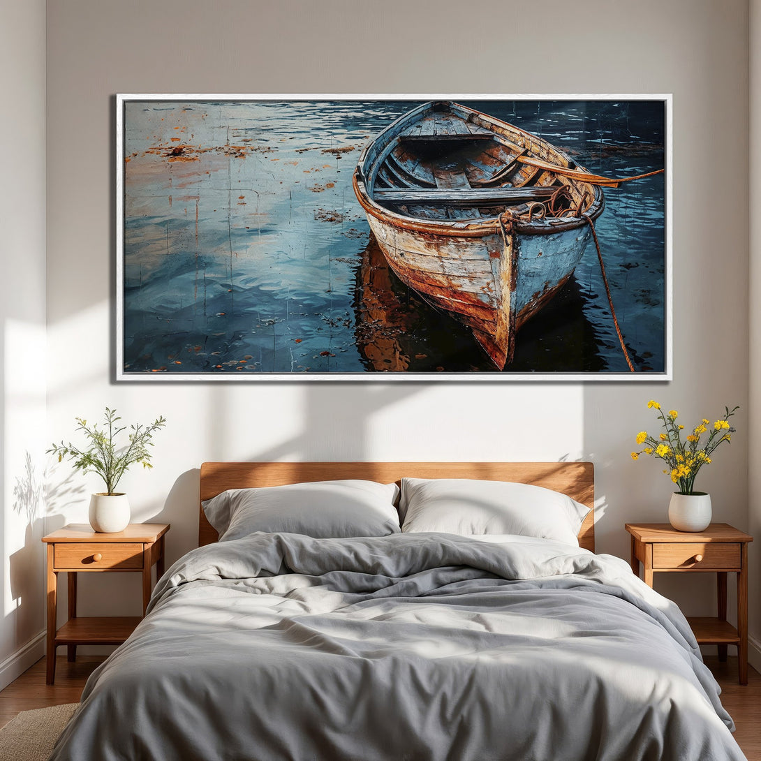 Framed Wall Art of a weathered boat on water, displayed in a bedroom. Coastal style, blue and orange color palette. Bring the ocean home!