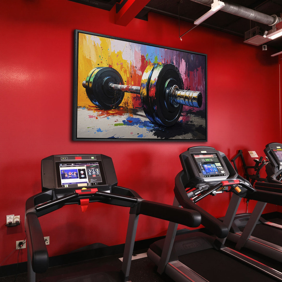 Framed Wall Art: Abstract barbell canvas print in a gym. Colorful, vibrant artwork with a red, yellow, and black palette. Perfect for a workout space.