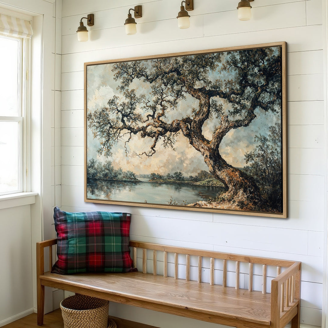 Framed Wall Art featuring a serene landscape painting with a large tree, displayed in a cozy interior. Earthy tones and a classic style.