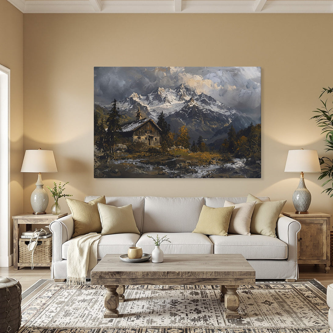 Framed Wall Art: Mountain landscape Canvas Print in a warm interior. Classic style, featuring a cabin and snowy peaks. Earthy tones.