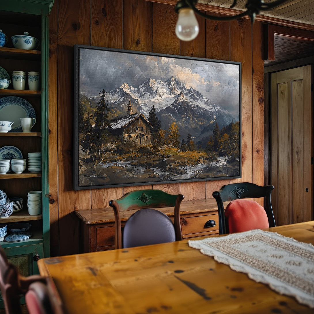 Framed Wall Art: Mountain landscape canvas print in a rustic dining room. Features a moody, painterly style with cool blues, greens, and warm earth tones.