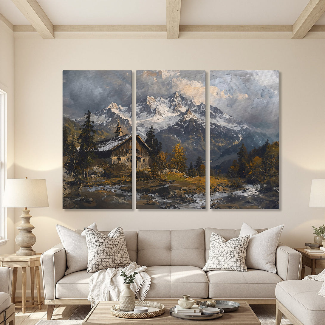 Canvas Print of a mountain landscape painting in a cozy living room. Features a moody, neutral color palette with touches of gold. Perfect wall art.