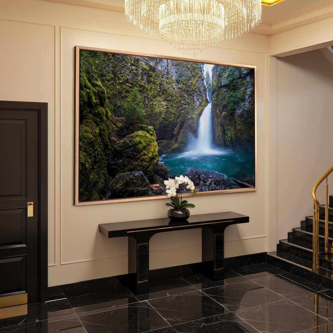 Framed Wall Art: Stunning waterfall canvas print in a luxurious interior. Green, blue, and neutral tones create a serene, nature-inspired aesthetic.