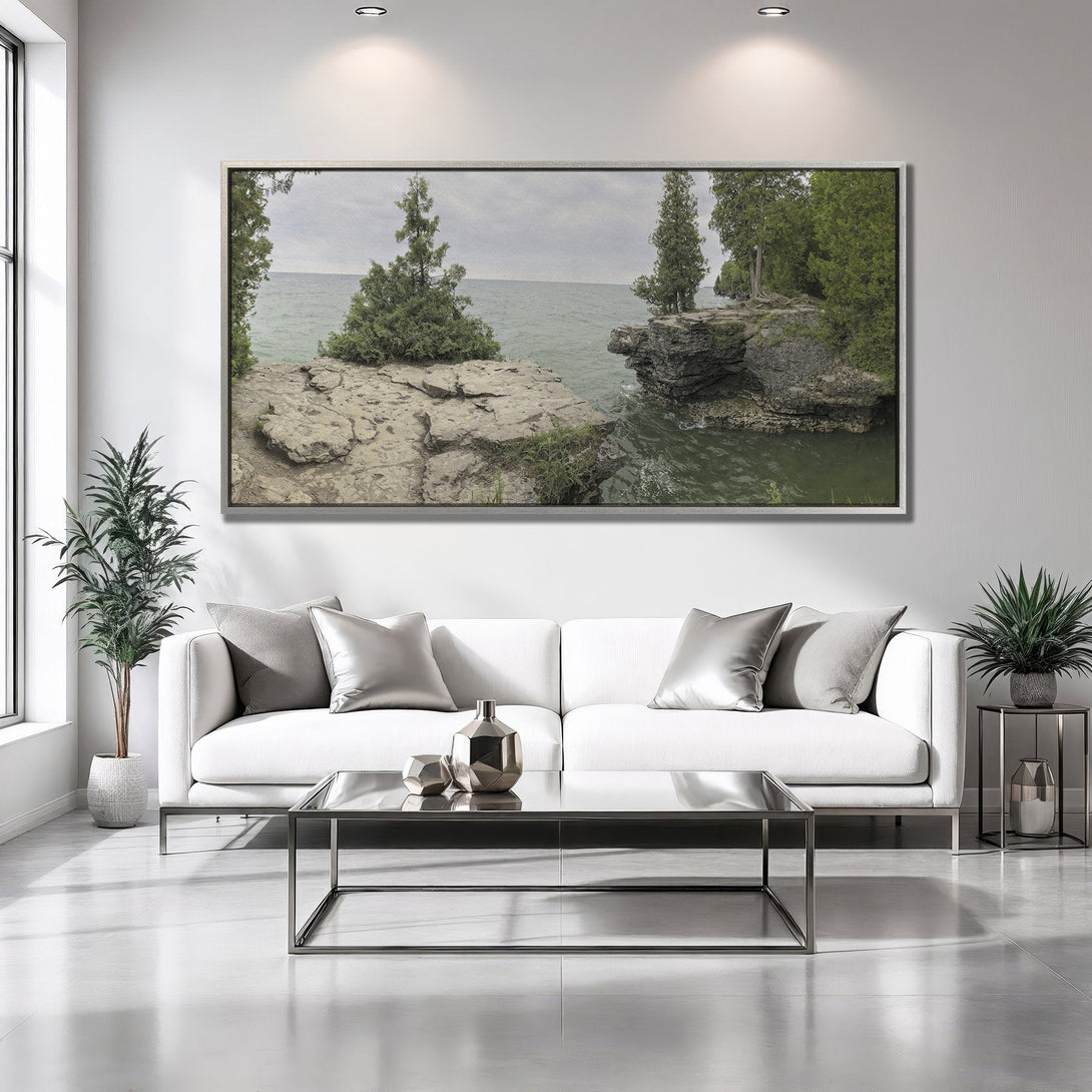 Framed Wall Art of a coastal landscape in a modern living room. Natural green and gray tones create a serene, minimalist aesthetic.