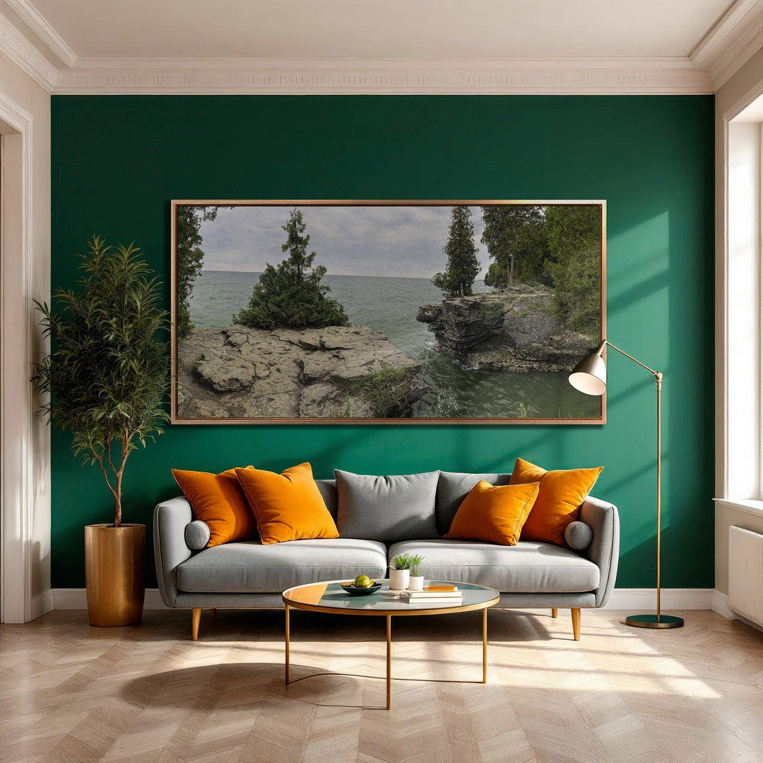Framed Wall Art of a coastal landscape in a modern living room. Earthy tones with a pop of orange create a stylish, inviting space.