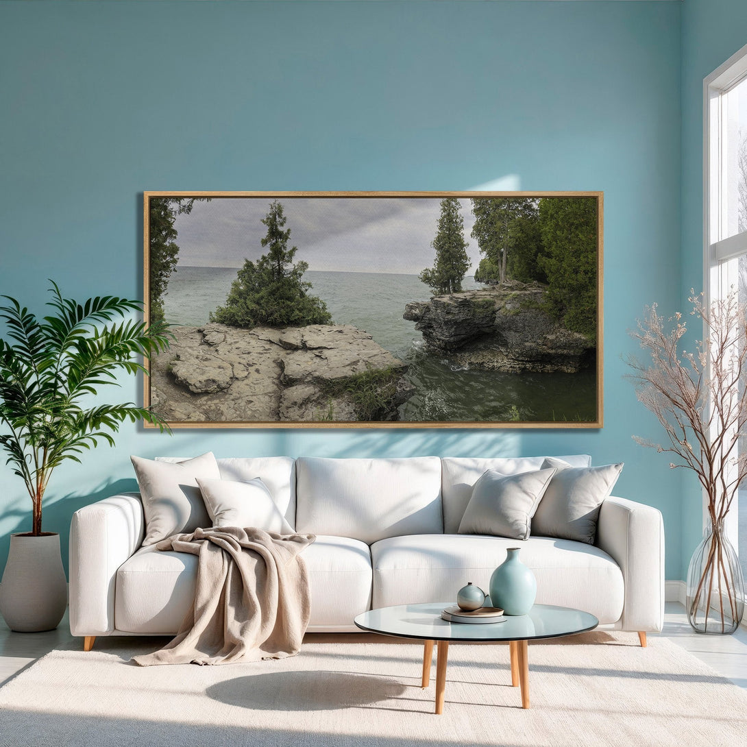 Framed Wall Art: Coastal landscape canvas print in a modern living room. Features a neutral color palette with greens and blues. Perfect for home decor.