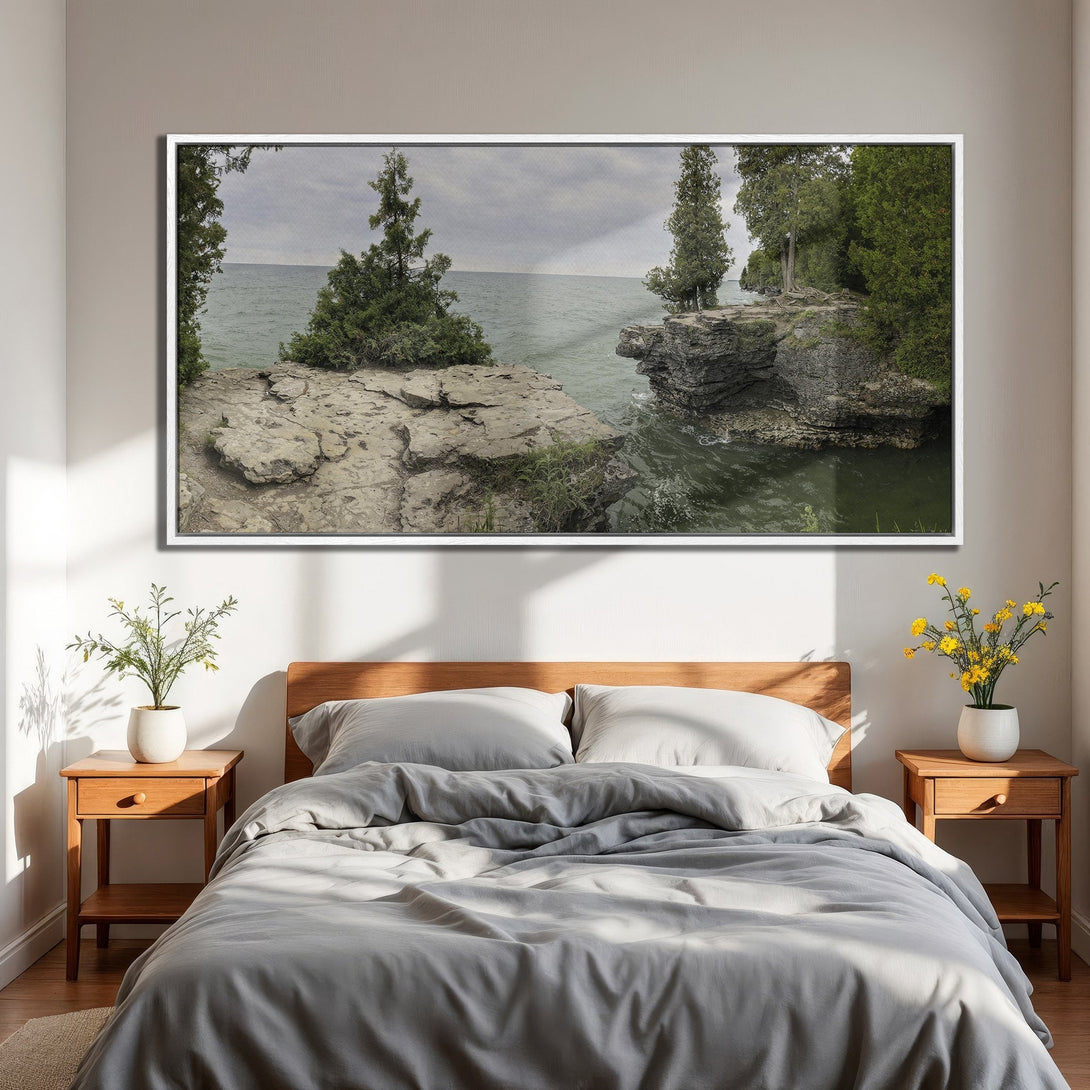 Framed Wall Art: Coastal landscape Canvas Print in a bedroom. Features a serene seascape with green, gray, and neutral tones, perfect for a calming interior.