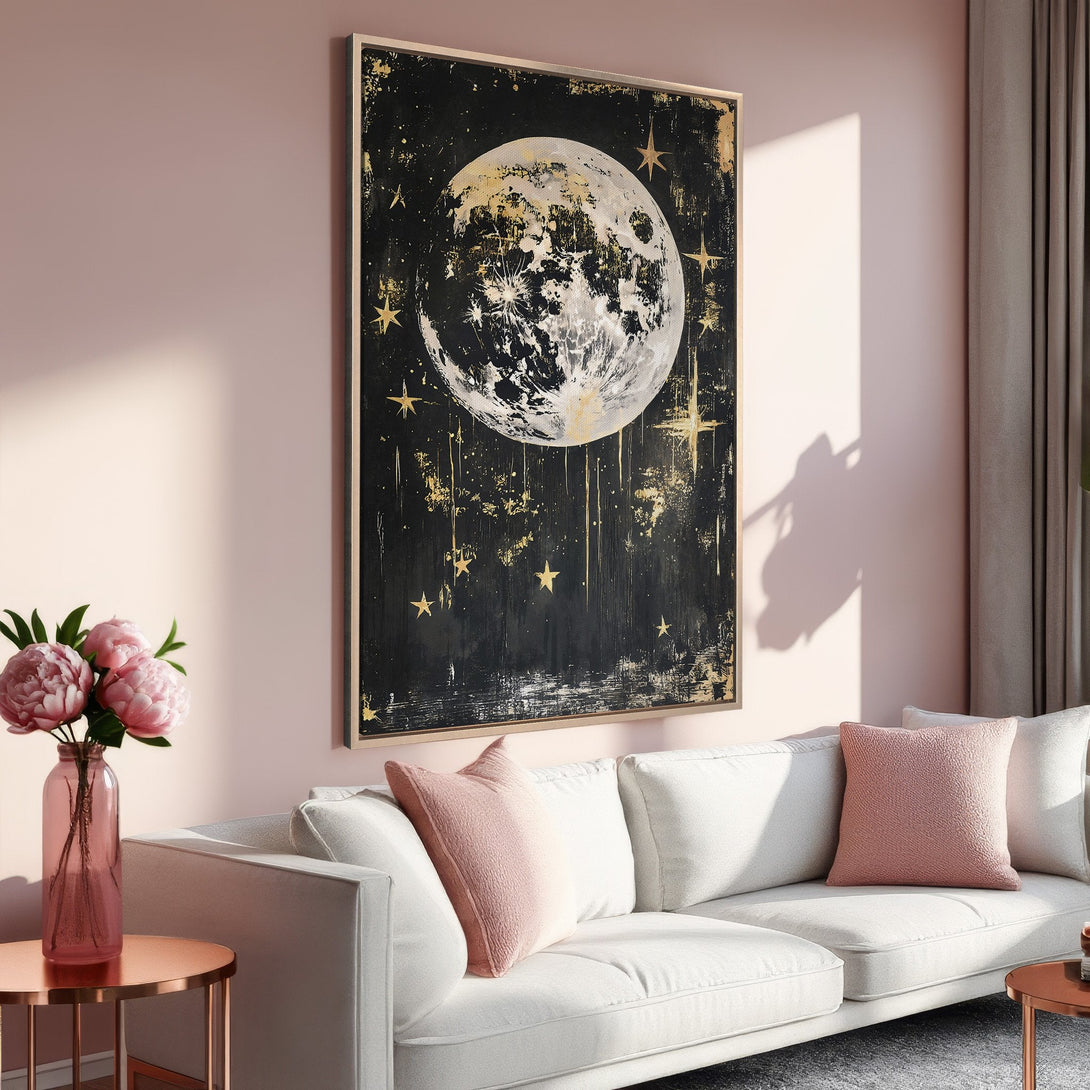 Framed Wall Art featuring a celestial moon and stars in a modern, abstract style. Black, gold, and blush tones create a serene and stylish interior.