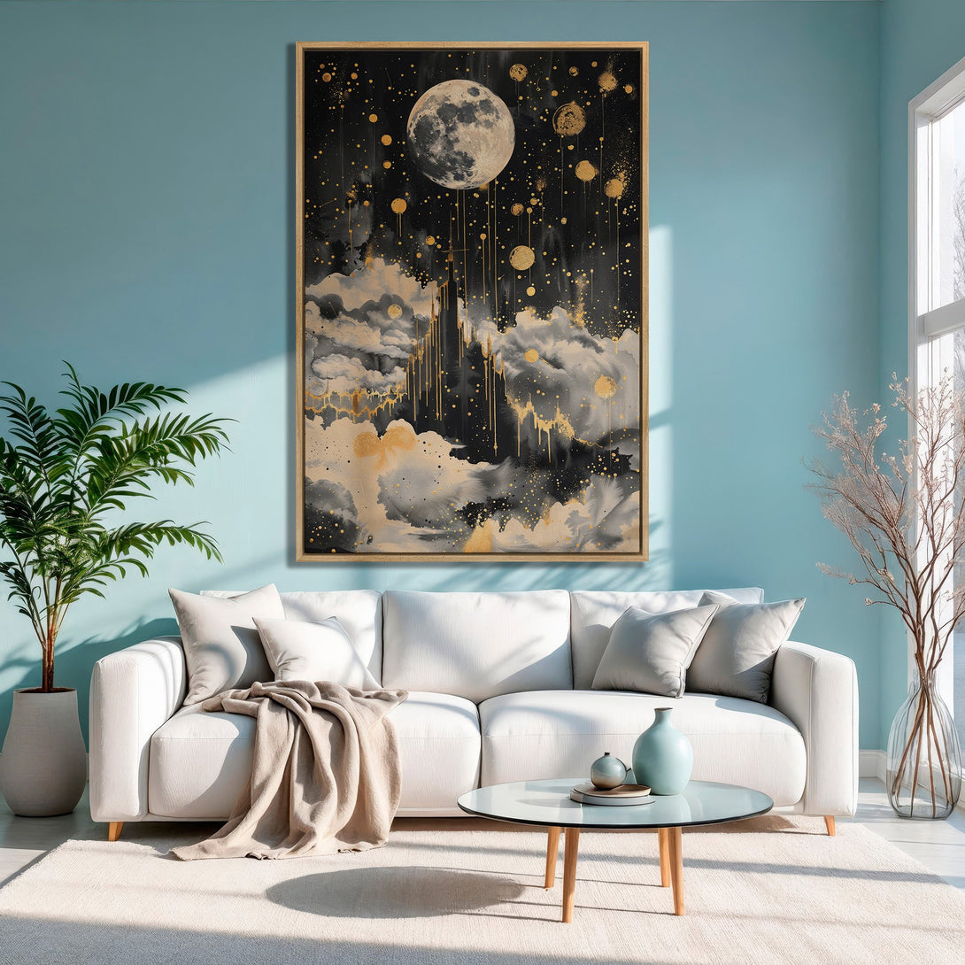 Framed Wall Art featuring a celestial moon and cloudscape in black, gold, and gray tones. Modern art perfect for adding a touch of elegance to any space.