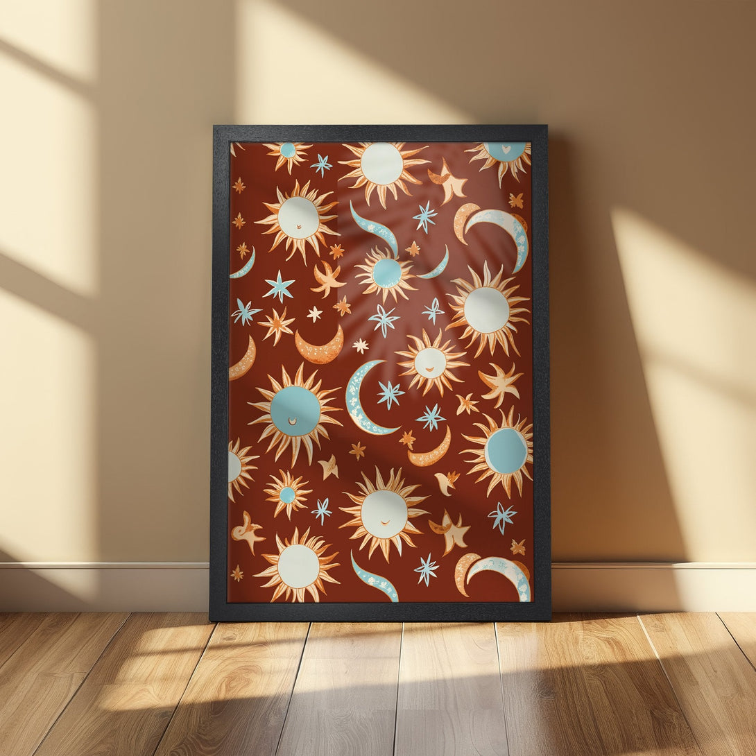 Framed Poster featuring a celestial pattern of suns, moons, and stars in a warm, earthy color palette. Boho wall art.