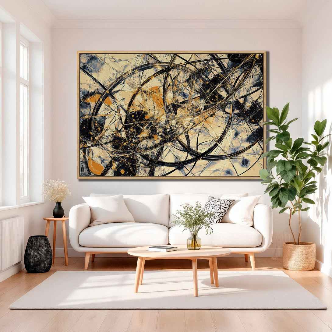 Framed Wall Art featuring abstract black, beige, and gold art. Modern Canvas Print adds a touch of elegance to any living room.