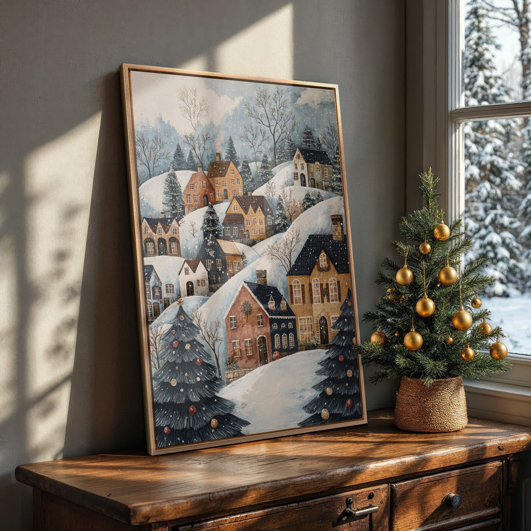 Framed Wall Art of a winter village scene in watercolor style, featuring a cozy color palette of blues, browns, and whites. Perfect for holiday decor!