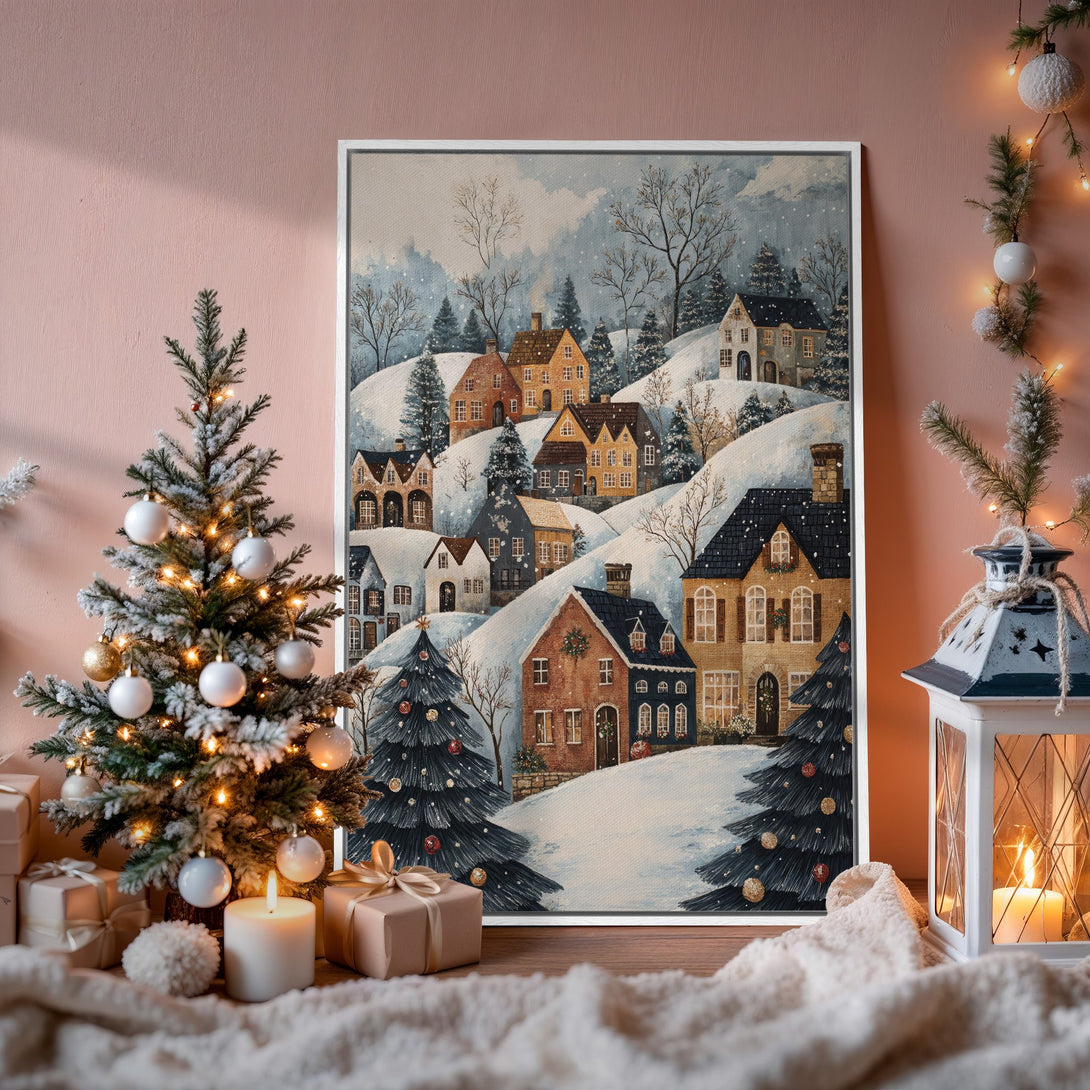 Framed Wall Art featuring a charming winter village scene in watercolor style. Warm, inviting color palette with snowy hills and cozy homes. Perfect holiday decor.