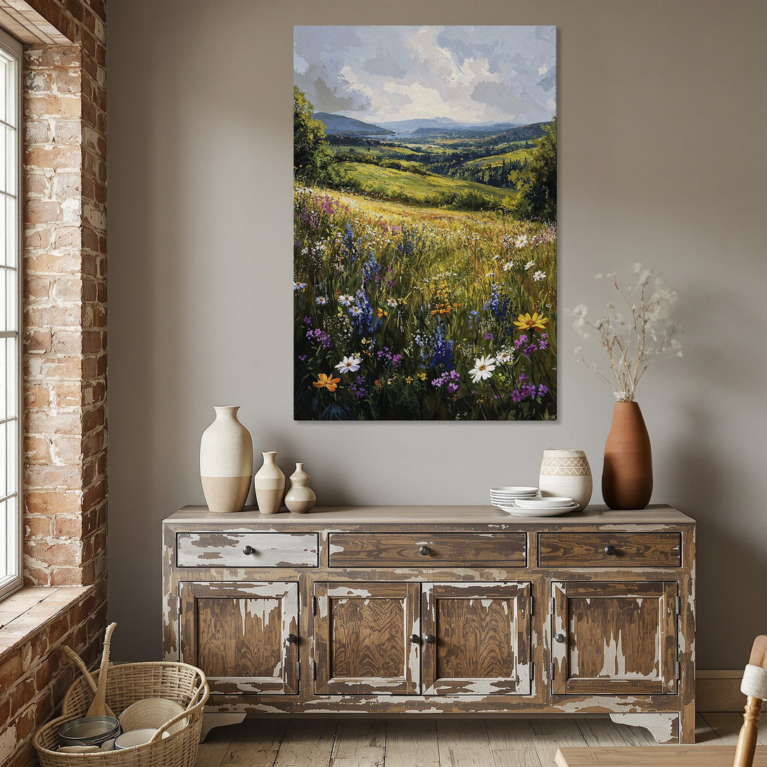 Framed Wall Art of a vibrant wildflower meadow landscape in a dining room. Warm, inviting color palette with greens, blues, yellows, and purples.