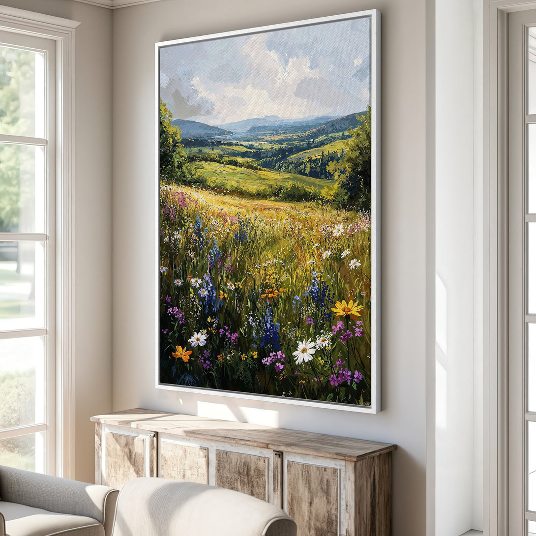 Framed Wall Art of a vibrant wildflower meadow landscape painting. Warm, inviting color palette with blues, greens, and yellows. Perfect for adding a touch of nature to your home.