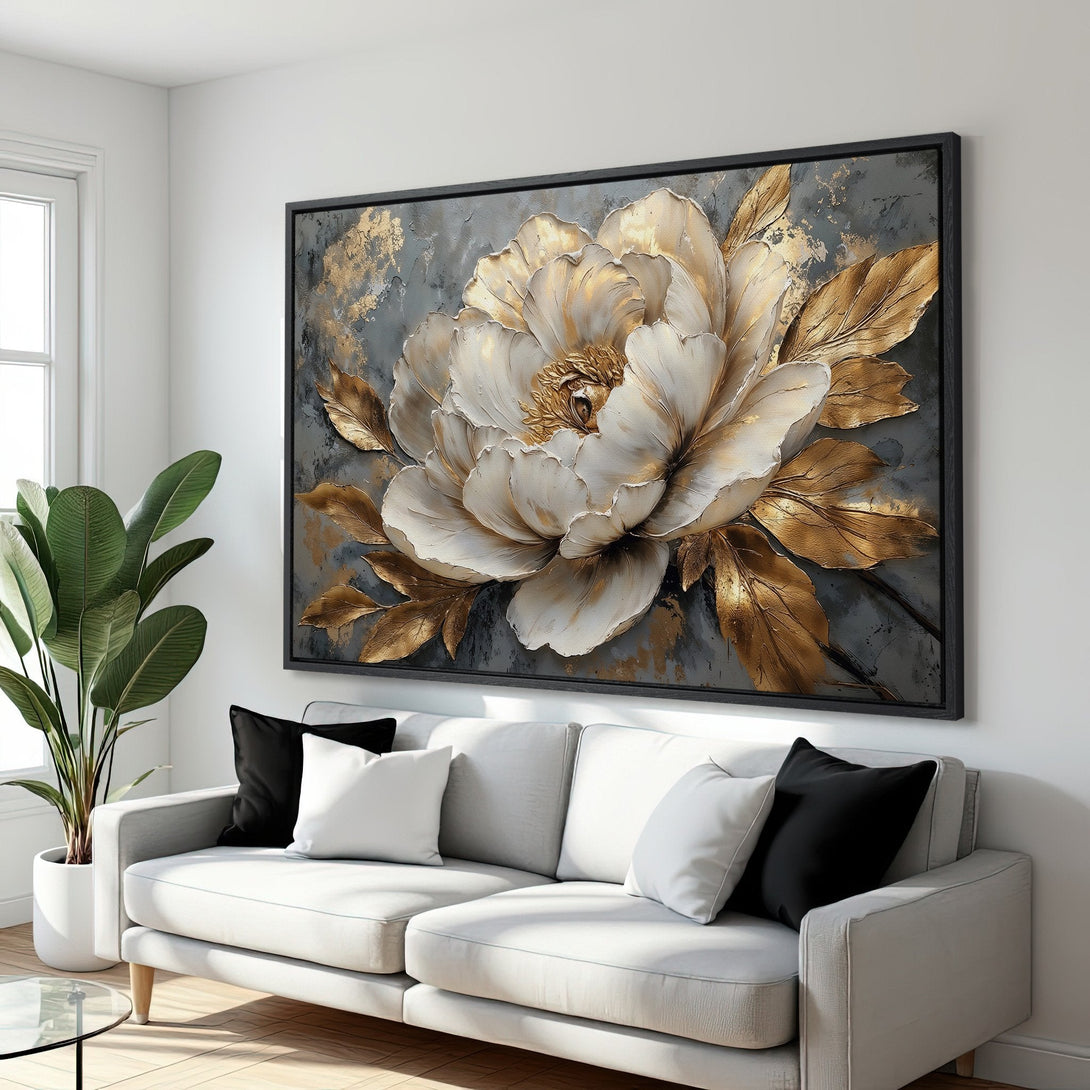 Framed Wall Art: Elegant floral canvas print in gold and white, displayed in a modern living room. Adds a touch of luxury to any space.