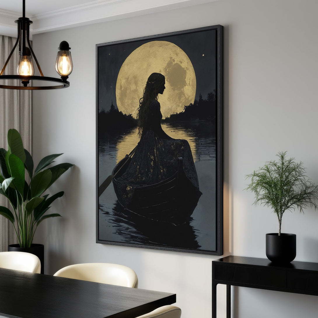 Framed Wall Art: Serene woman in boat under golden moon. Dark, moody art print in a modern interior. Perfect for adding a touch of elegance.