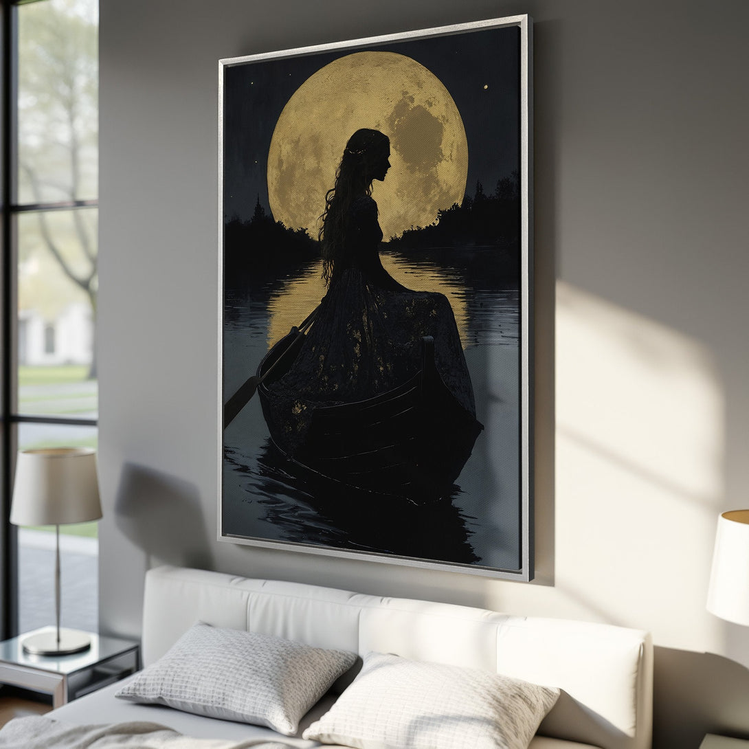 Framed Wall Art: Silhouette of a woman on a boat under a golden moon. Dramatic, artistic style with a black, gold, and gray color palette. Perfect bedroom decor.