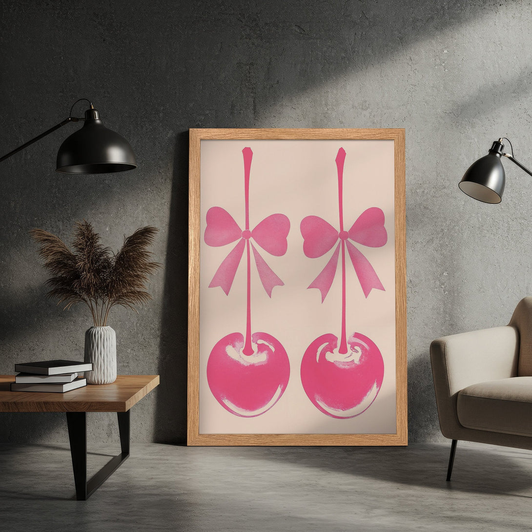 Framed Poster featuring pink cherries with bows on a light background. Modern art style with a pink and neutral color palette.