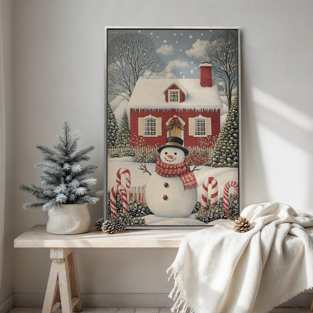 Framed Wall Art: Festive winter scene with snowman, red house, and candy canes. Charming, vintage style in a warm, inviting color palette. Perfect holiday decor.