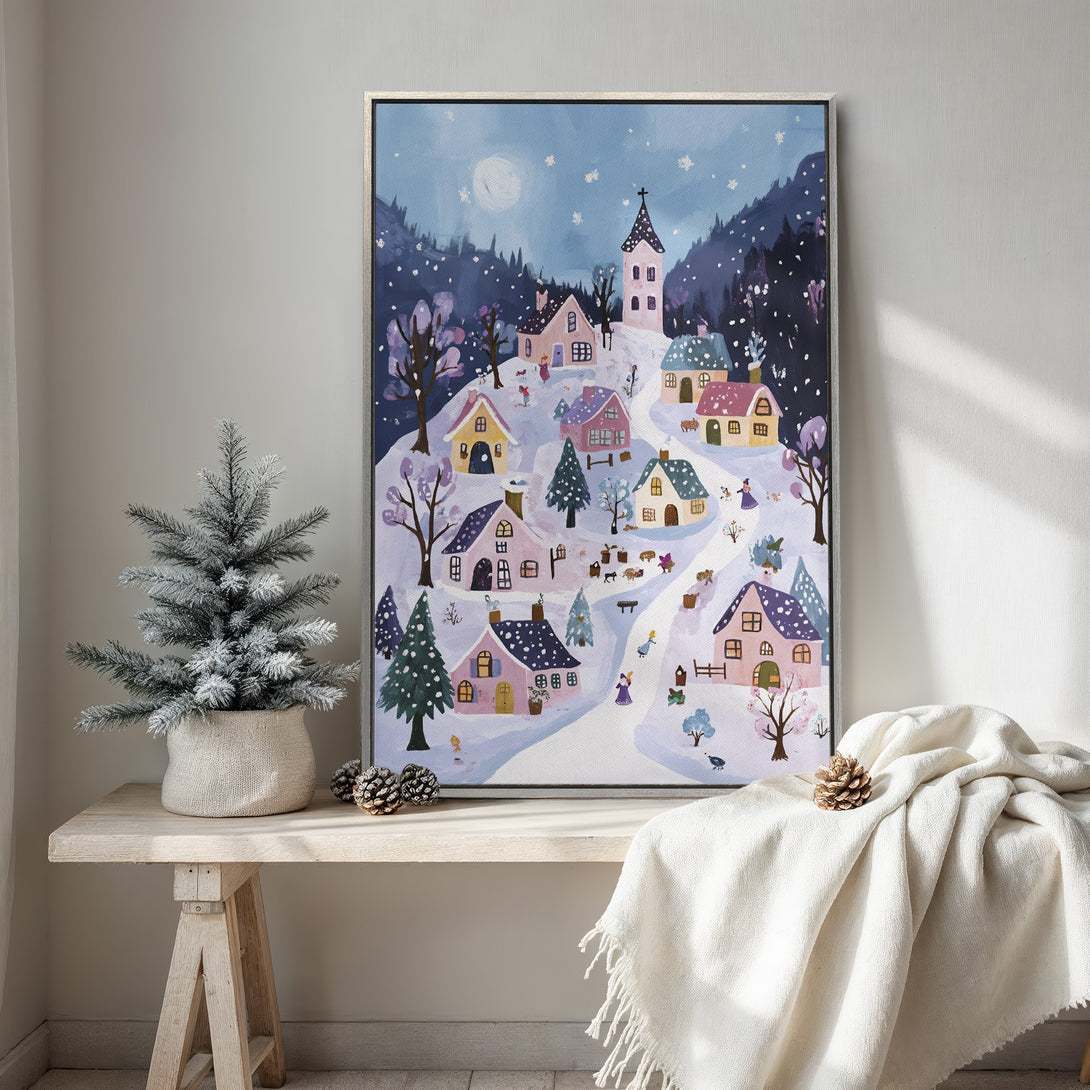 Framed Wall Art of a whimsical winter village scene in a soft, pastel color palette. Perfect for adding a cozy touch to your home decor.