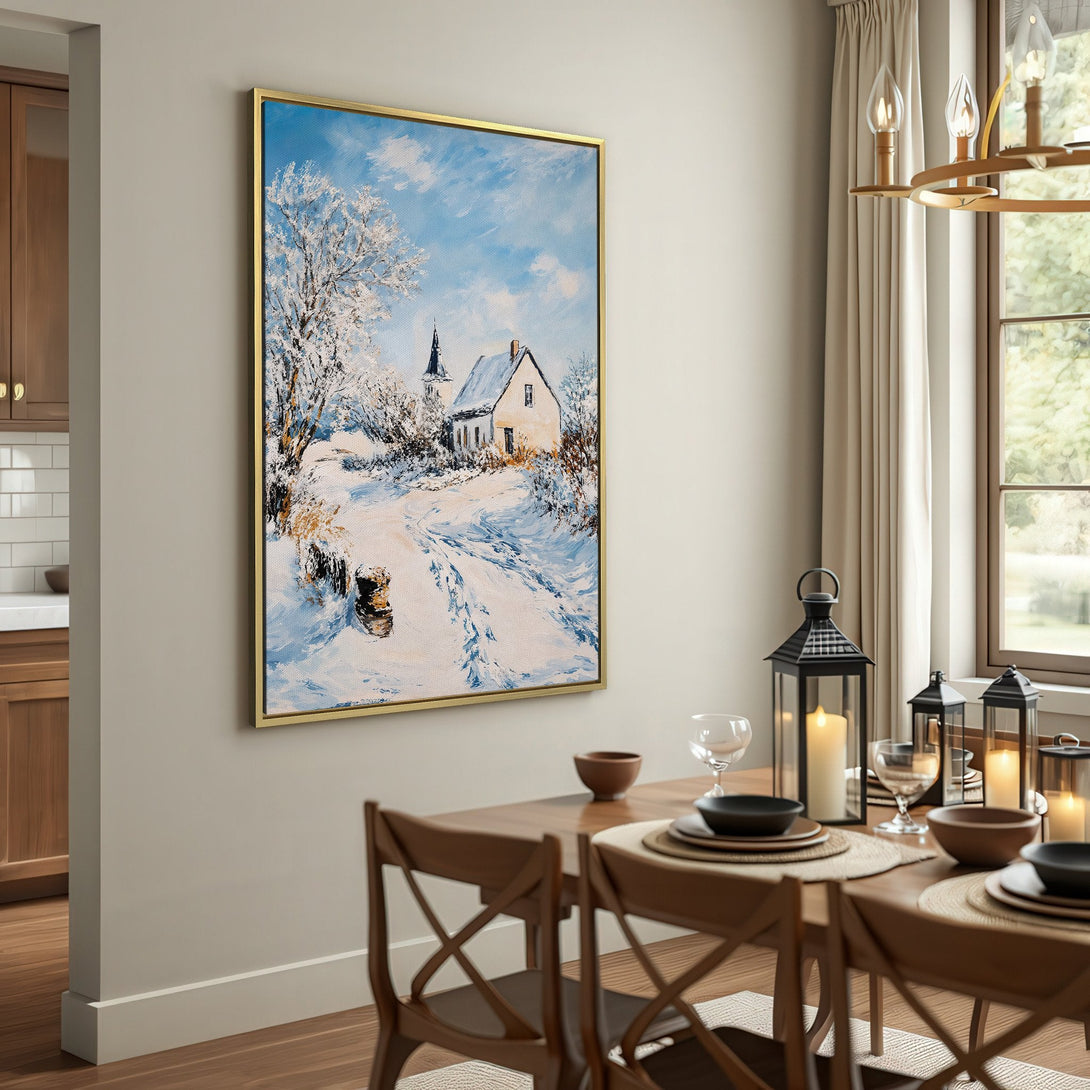 Canvas Print of a winter landscape painting with a white house and snowy path, in a cozy interior with a neutral color palette.