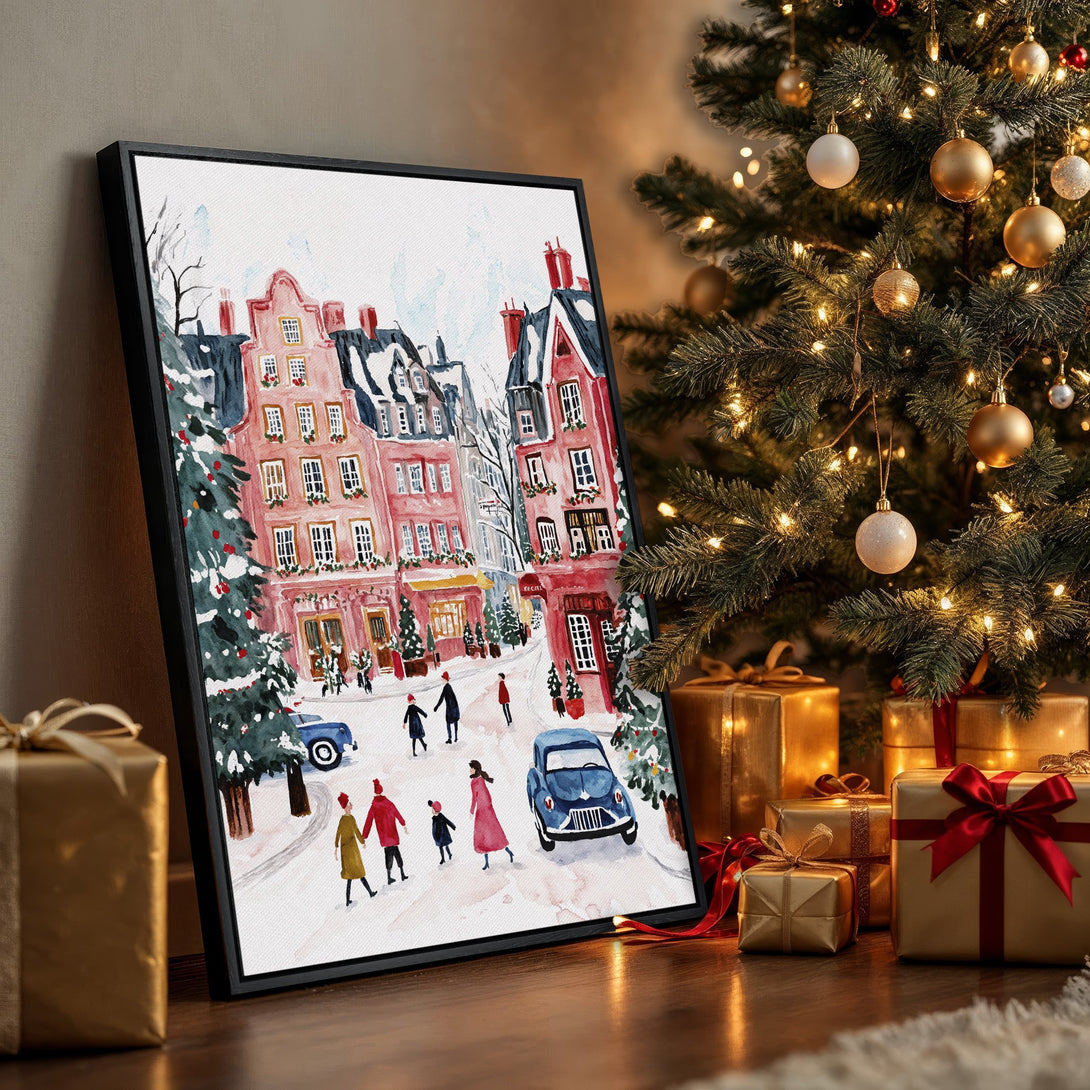 Framed Wall Art of a charming winter street scene in watercolor style, featuring pink buildings and a festive Christmas color palette. Perfect holiday decor!