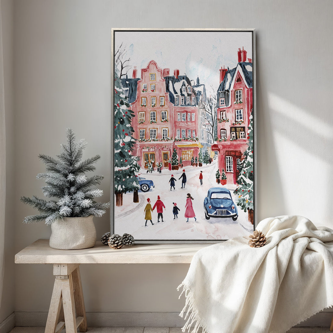 Framed Wall Art featuring a charming watercolor winter scene with pink buildings and a touch of blue. Perfect for cozy holiday decor.