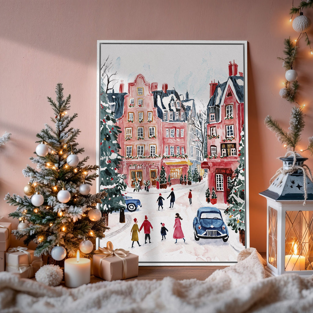 Framed Wall Art: Watercolor winter scene with pink buildings, blue cars, and people. Perfect for holiday decor, warm color palette.