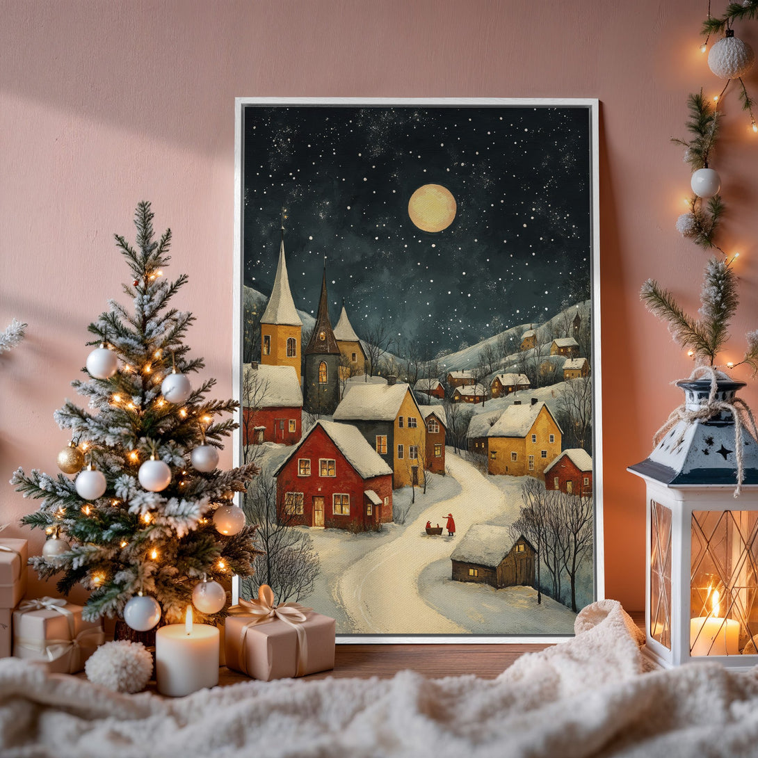 Framed Wall Art of a winter village scene. Cozy, whimsical style with a warm color palette of reds, yellows, and blues. Perfect for holiday decor!