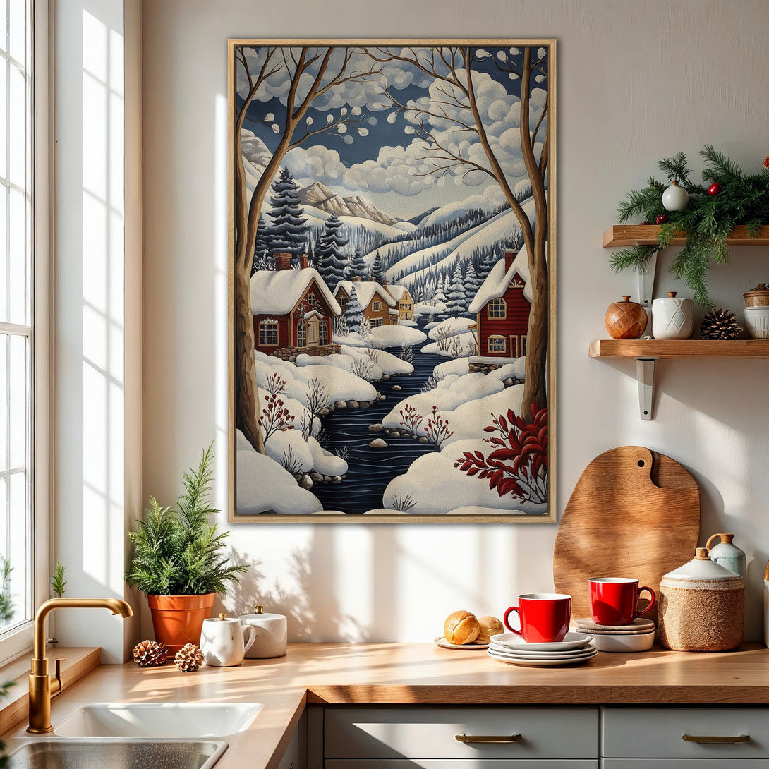 Framed Wall Art featuring a winter landscape scene with snow-covered houses, trees, and a river. The artwork has a vintage style with a blue and white color palette.