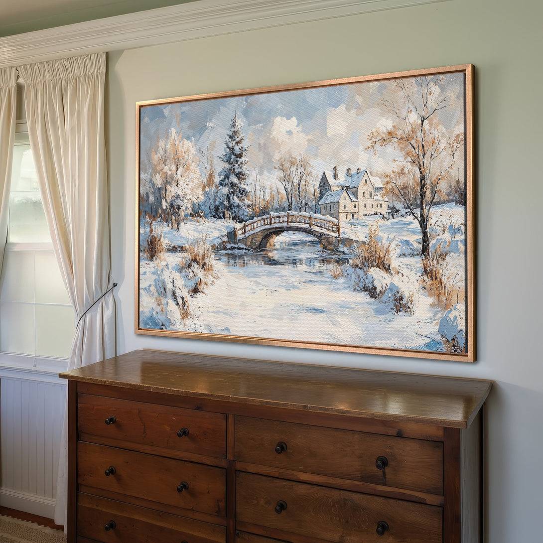 Framed Wall Art: Winter landscape Canvas Print with a bridge, houses, and snow, in a cool blue and neutral color palette, perfect for home decor.