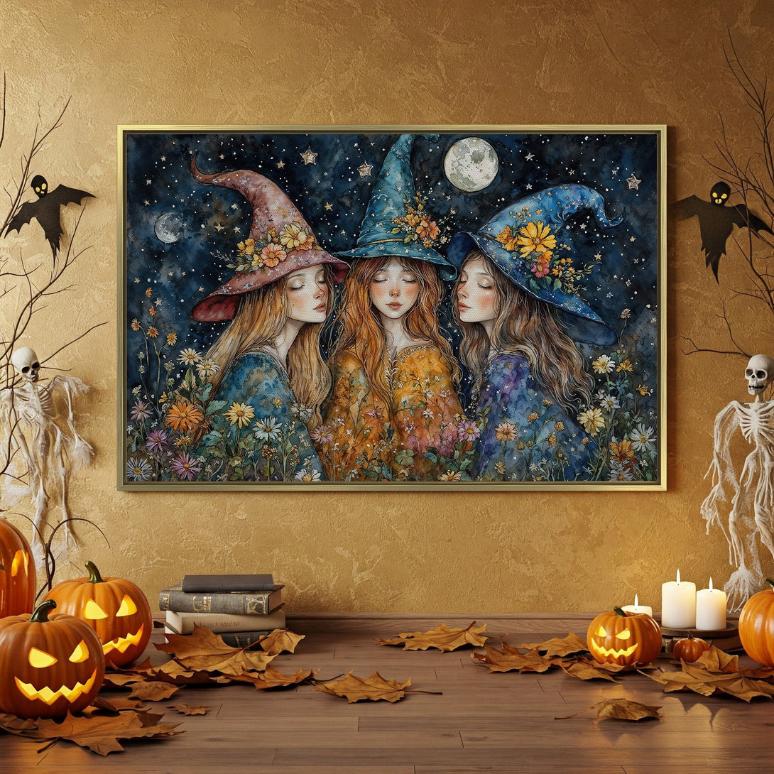 Canvas Print of three witches in a whimsical, watercolor style, with a dark blue, orange, and gold color palette. Perfect Halloween decor!