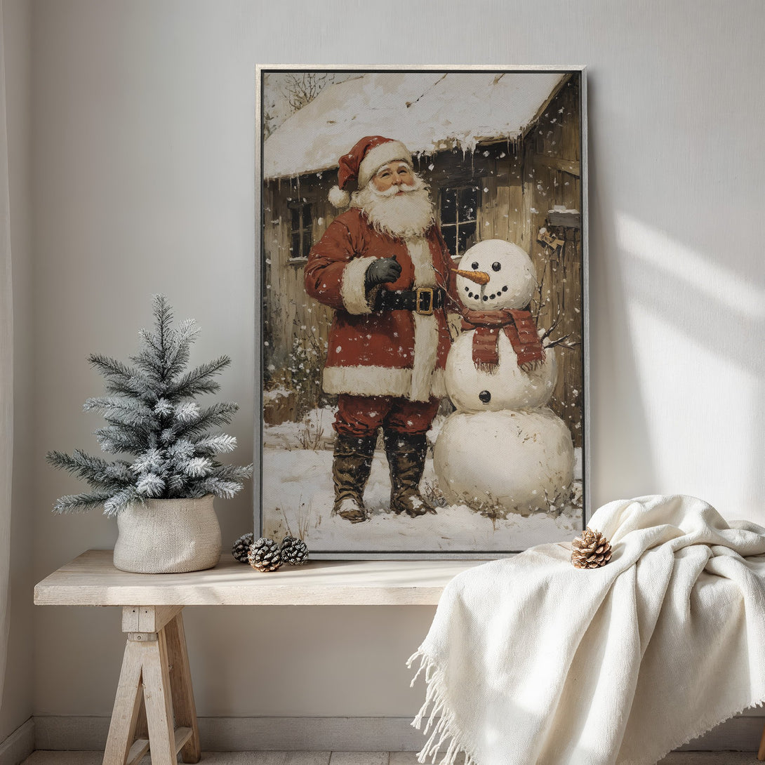 Framed Wall Art: Vintage Santa Claus painting with snowman in a snowy scene. Rustic style, warm red and neutral color palette. Perfect Christmas decor!