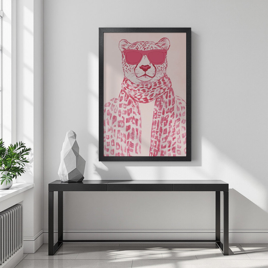 Framed Poster featuring a stylish cheetah wearing sunglasses and scarf. Modern art in pink and white, perfect wall decor.