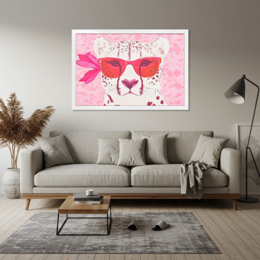 Framed Poster featuring a stylish cheetah with sunglasses, pop art style, pink and white color palette. Add a touch of fun to your space!