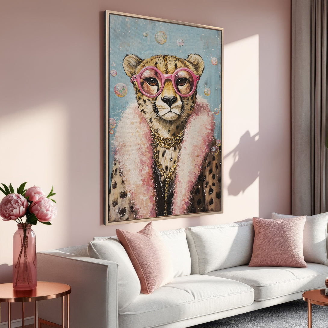 Framed Wall Art: Playful cheetah portrait with pink glasses, fur, and gold chain. Pastel pink and blue color palette. Perfect for adding a touch of glam to your home.