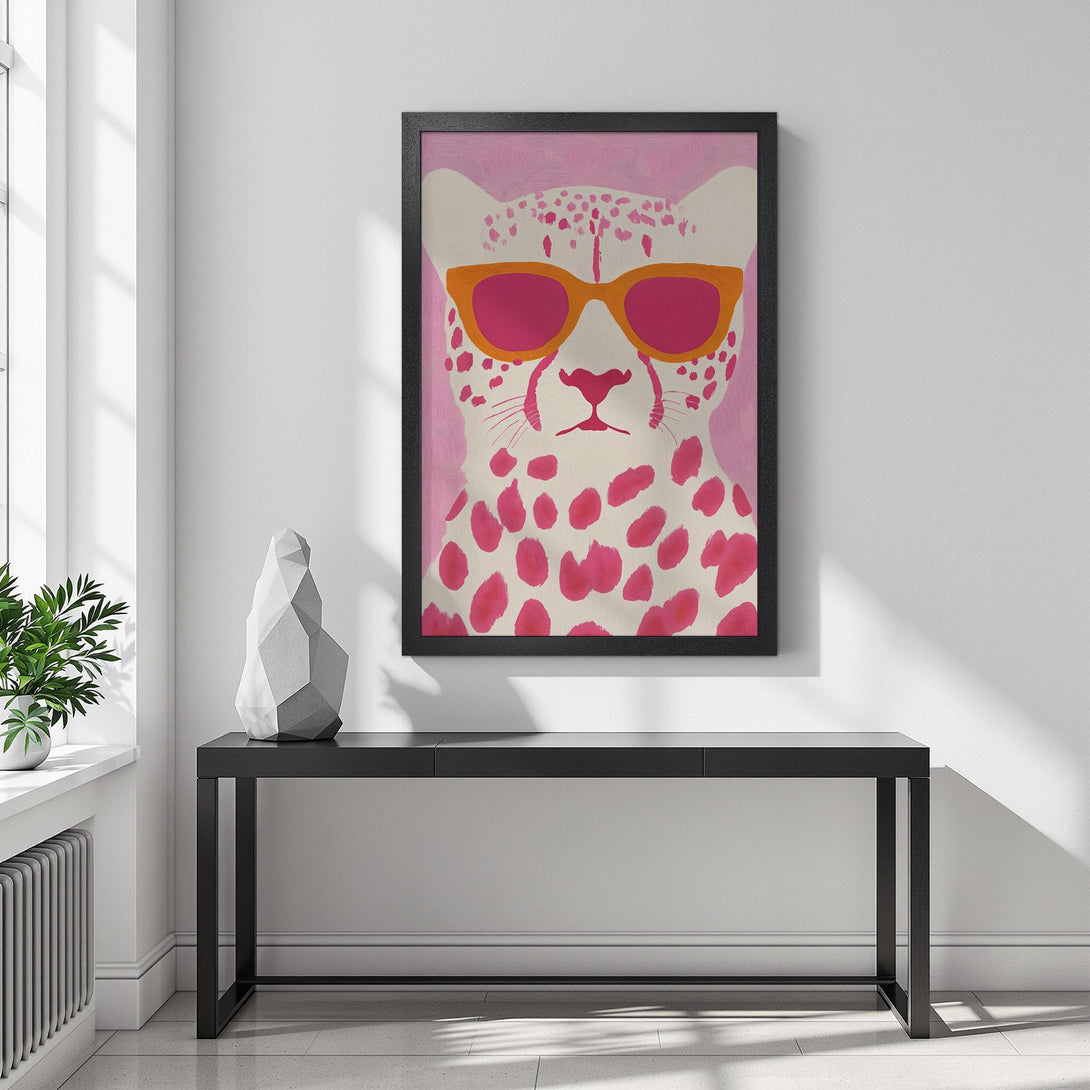 Framed Poster featuring a cool cheetah wearing sunglasses. Stylish artwork with pink, orange, and white color palette. Add a pop of art to your space!